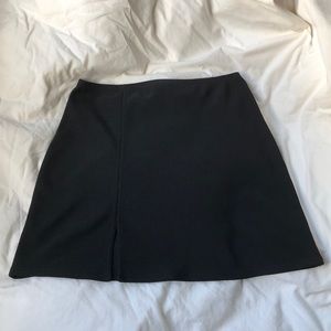 No Boundaries black mini skirt with small slit.